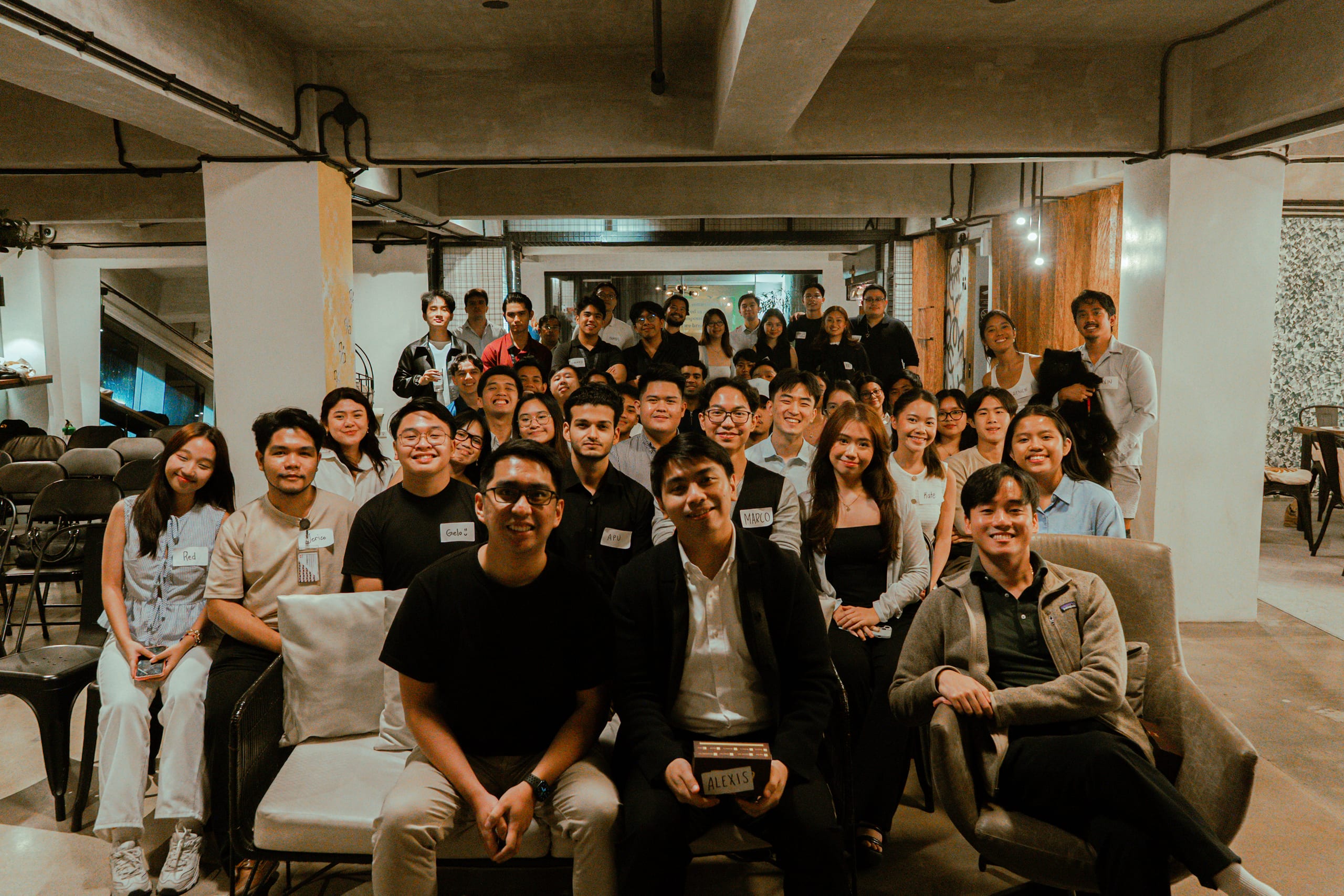 Student builders smiling together in a group photo at Start to Scale in Makati